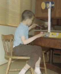 Eric Betzig as a chid building a giraffe from an egg carton, paper towel roll, and container of salt.