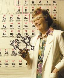 Edith Flanigen holds up a Zeolite model