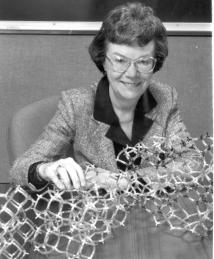 Edith Flanigen sits behind Zeolite model