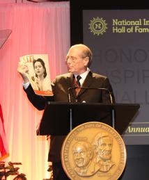 Speaker holds Life Magazine with Hedy Lamarr on the cover at National Inventors Hall of Fame Induction Ceremony