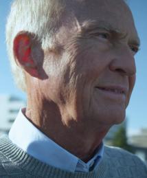 James McEwen pictured with city skyline in background